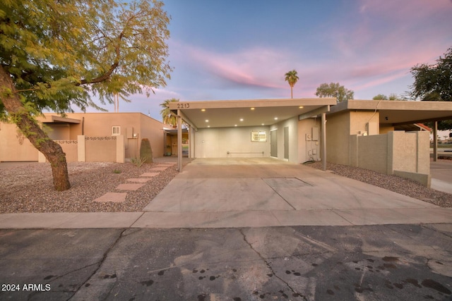 southwest-style home featuring a carport