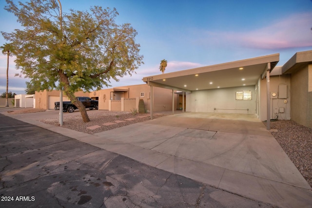 view of front of property with a carport