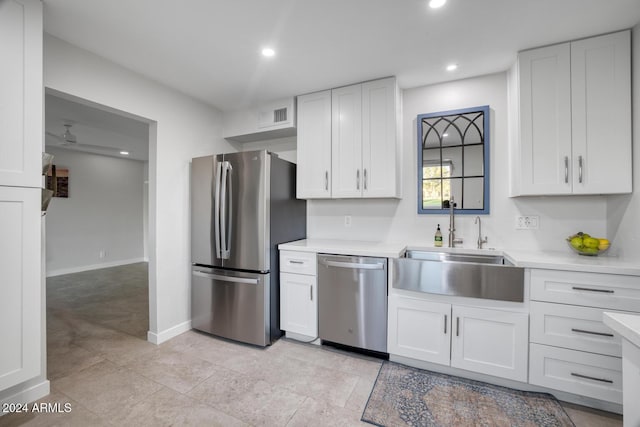 kitchen featuring white cabinetry, sink, ceiling fan, and appliances with stainless steel finishes