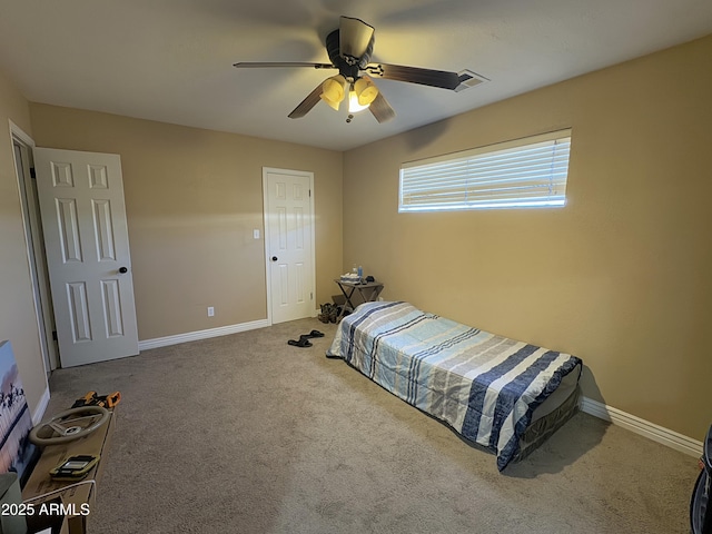 carpeted bedroom with ceiling fan