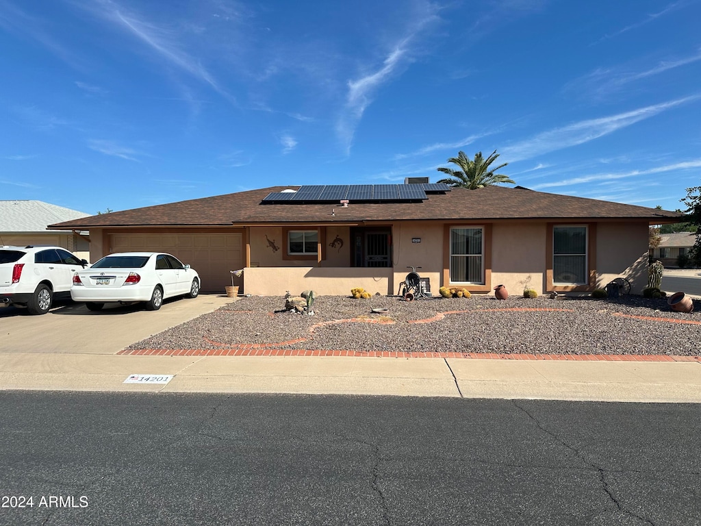 14201 N Crown Point Ct, Sun City, AZ 85351 - single story home with solar panels and a garage