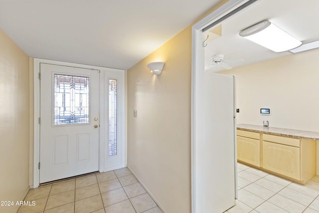 entryway with light tile patterned floors