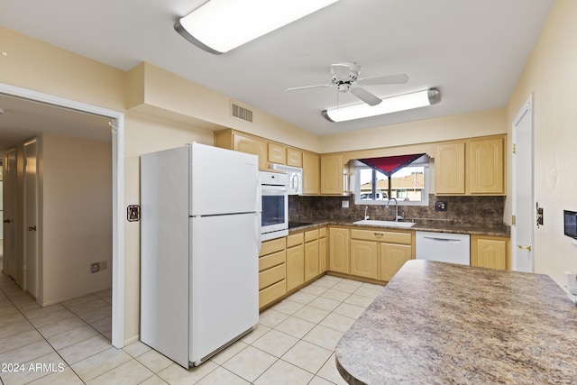 kitchen featuring white appliances, backsplash, sink, ceiling fan, and light brown cabinetry