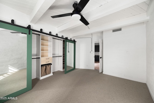 unfurnished bedroom with carpet, ceiling fan, and beam ceiling