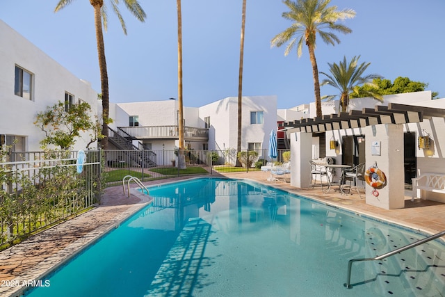 view of swimming pool with a patio