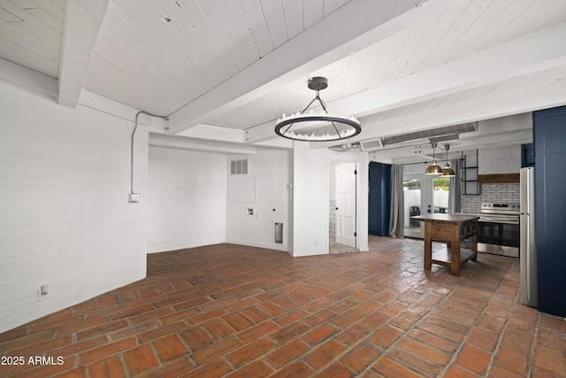 basement featuring stainless steel fridge and french doors