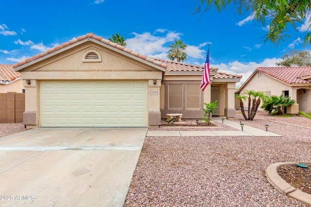 13359 W Post Dr, Surprise, AZ 85374 - view of front of property with stucco siding, driveway, an attached garage, and a tile roof