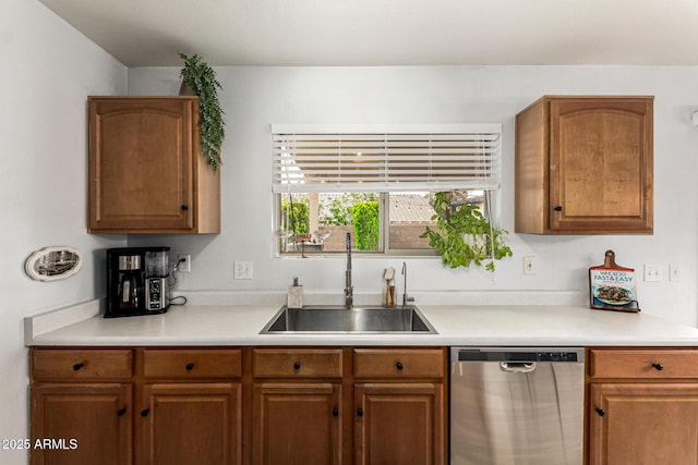 13359 W Post Dr, Surprise, AZ 85374 - kitchen with dishwasher, a sink, light countertops, and brown cabinets