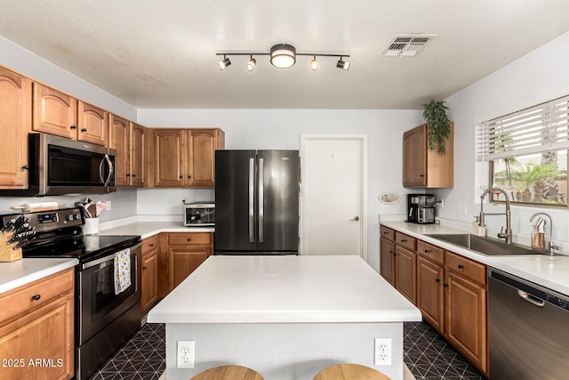 13359 W Post Dr, Surprise, AZ 85374 - kitchen featuring stainless steel appliances, a sink, dark floors, and light countertops