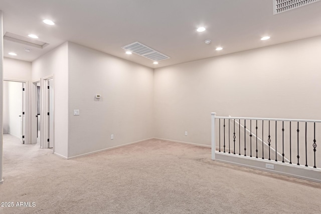 unfurnished room featuring recessed lighting and visible vents