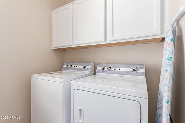 laundry room with cabinet space and independent washer and dryer