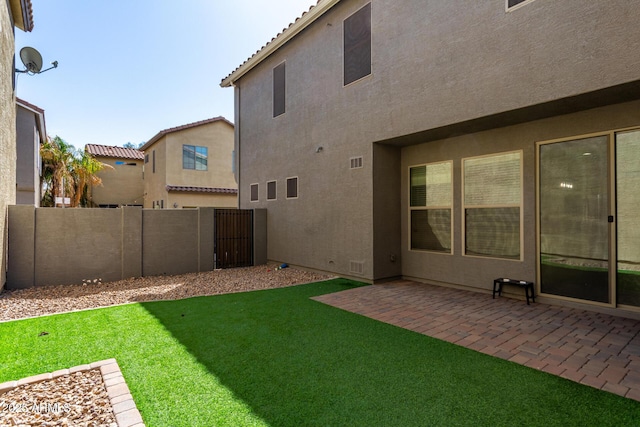 view of yard with a patio and fence