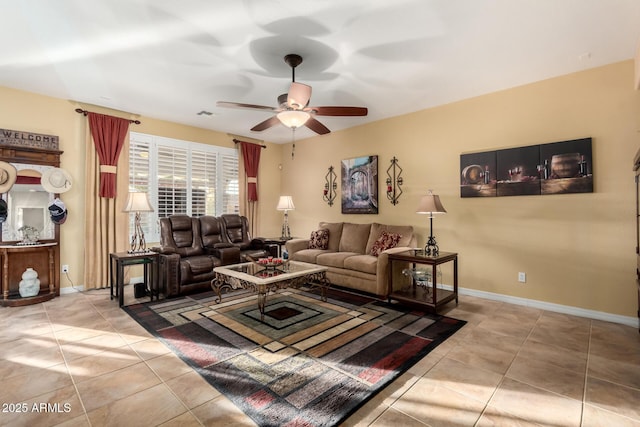 living room with ceiling fan and light tile patterned floors