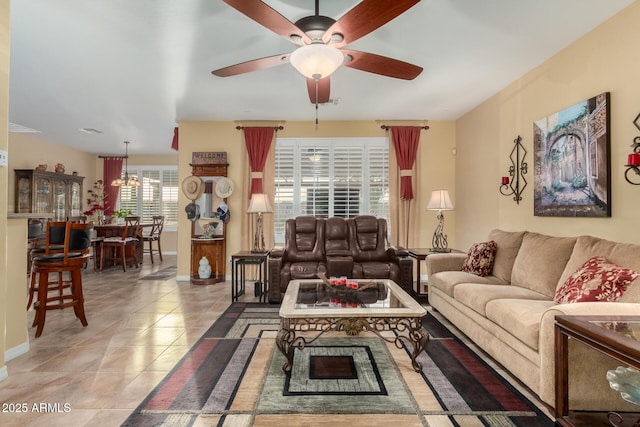 living room featuring tile patterned floors and ceiling fan