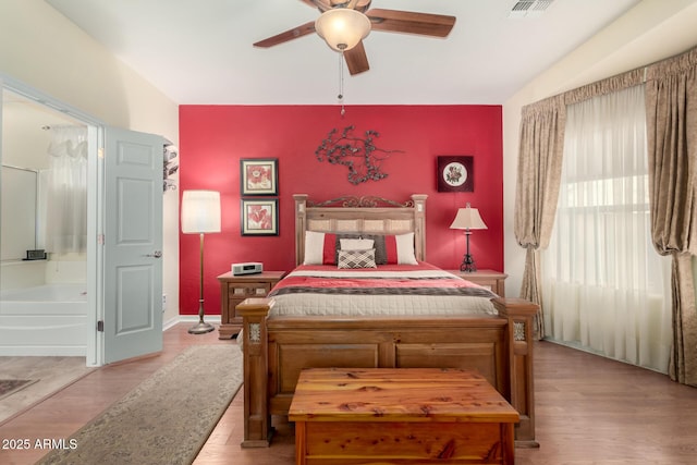 bedroom featuring light wood-type flooring and ceiling fan