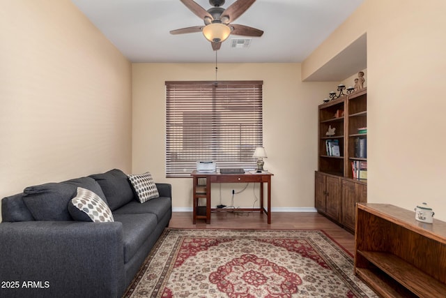 office area with ceiling fan and hardwood / wood-style floors