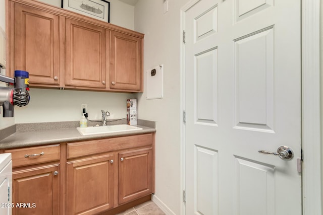 interior space featuring sink and light tile patterned floors