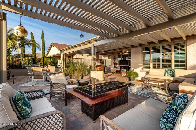 view of patio / terrace with an outdoor living space and a pergola