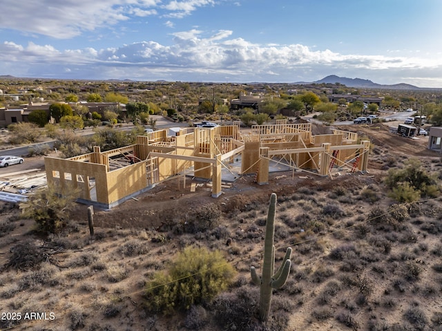 birds eye view of property featuring a mountain view