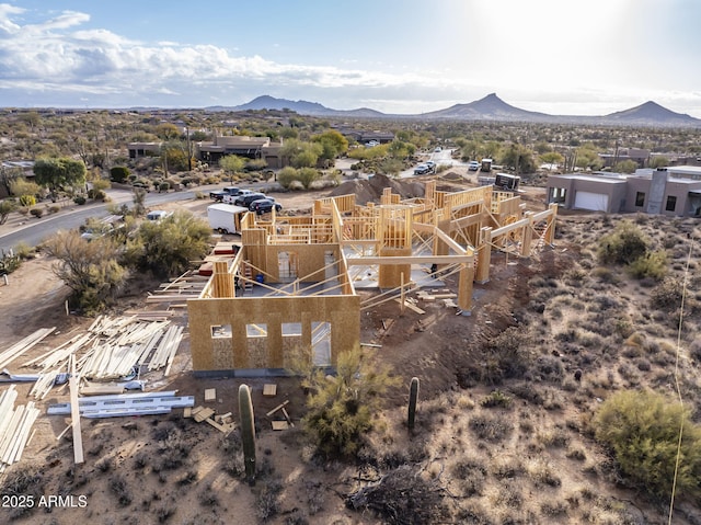 birds eye view of property featuring a mountain view