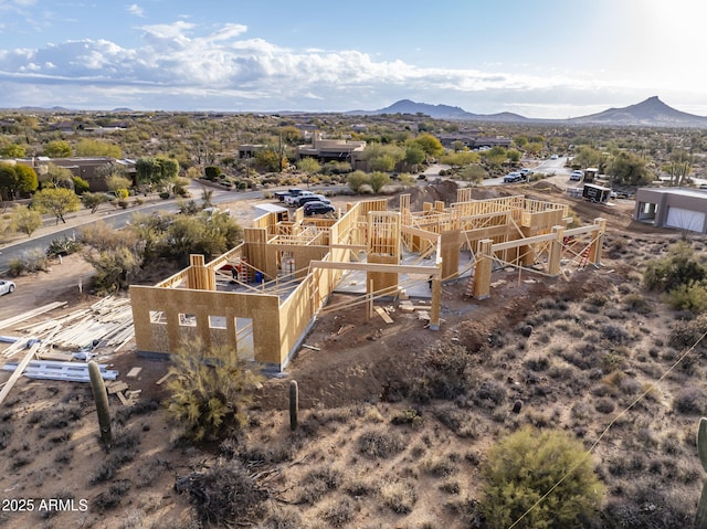 birds eye view of property featuring a mountain view