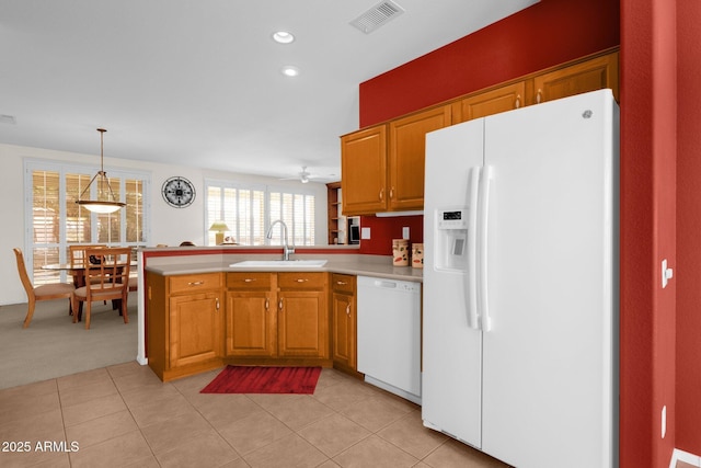 22622 N Mazatlan Dr, Sun City West, AZ 85375 - kitchen featuring visible vents, a sink, light countertops, a peninsula, and white appliances