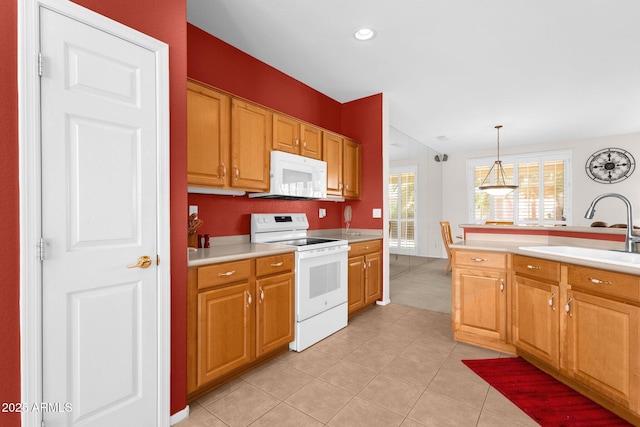 22622 N Mazatlan Dr, Sun City West, AZ 85375 - kitchen featuring hanging light fixtures, a sink, light countertops, white appliances, and light tile patterned flooring