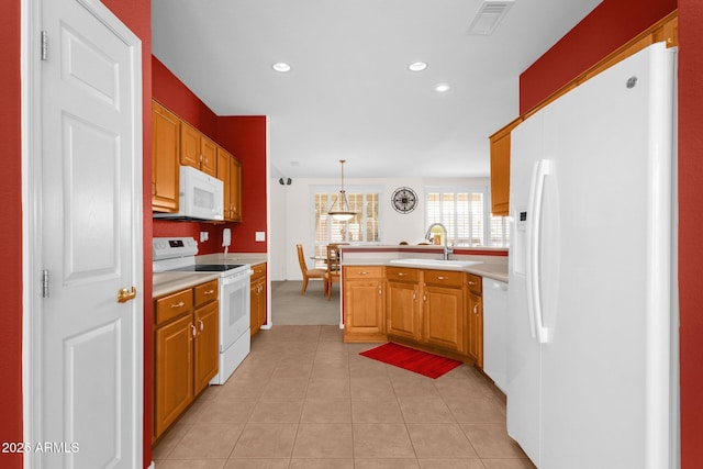 22622 N Mazatlan Dr, Sun City West, AZ 85375 - kitchen featuring visible vents, a sink, white appliances, and light countertops
