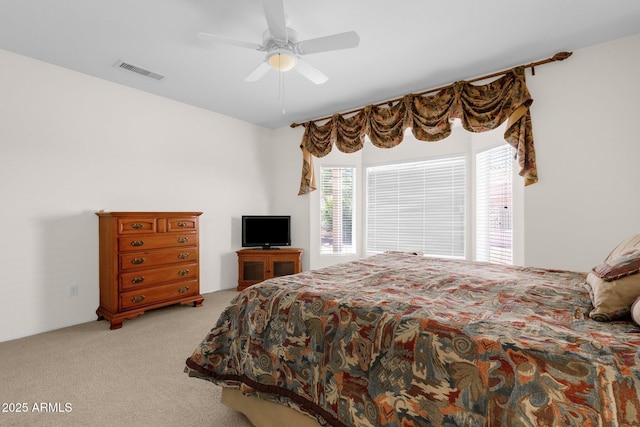 22622 N Mazatlan Dr, Sun City West, AZ 85375 - carpeted bedroom featuring ceiling fan, visible vents, and multiple windows
