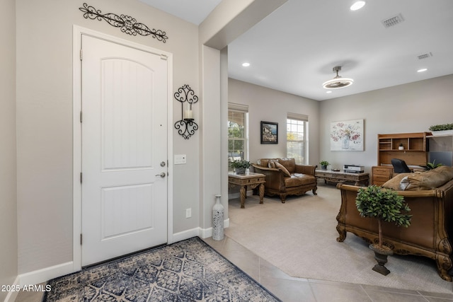 entrance foyer with carpet flooring