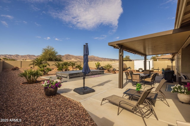 view of patio / terrace with a mountain view