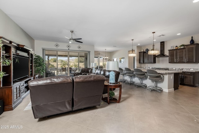 living room with light tile patterned floors and ceiling fan