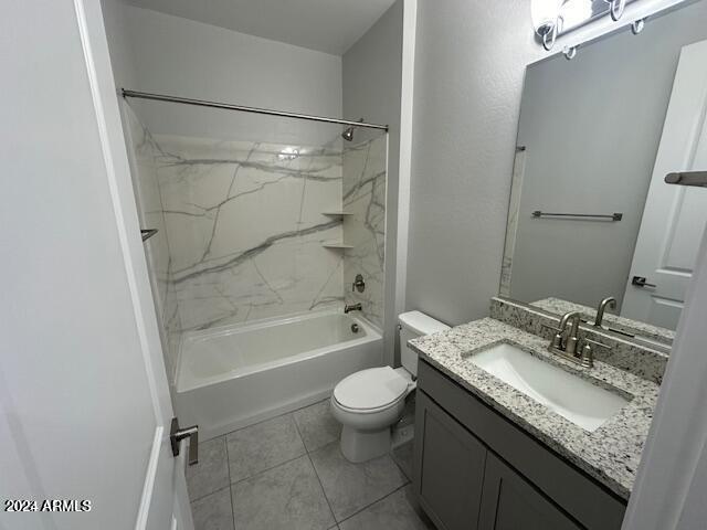 full bathroom featuring toilet, vanity, and tiled shower / bath combo