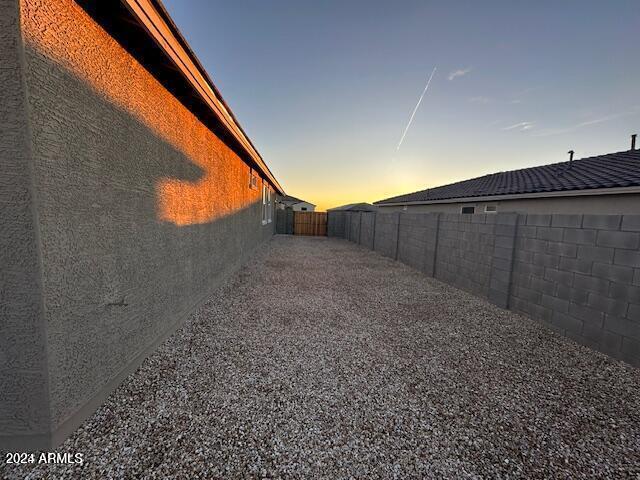 view of yard at dusk