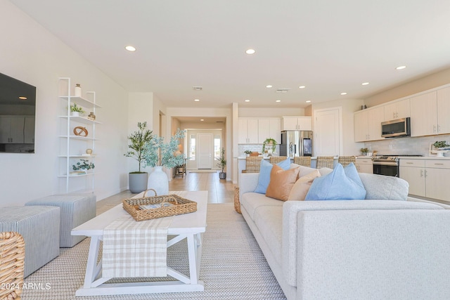 living room with light hardwood / wood-style floors