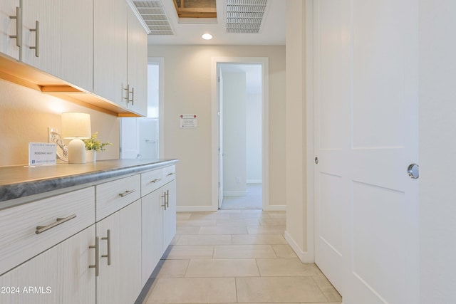 kitchen with light tile patterned flooring