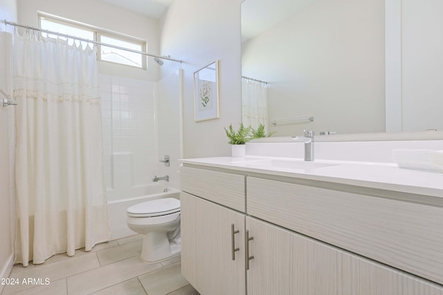 full bathroom featuring toilet, tile patterned floors, vanity, and shower / tub combo with curtain