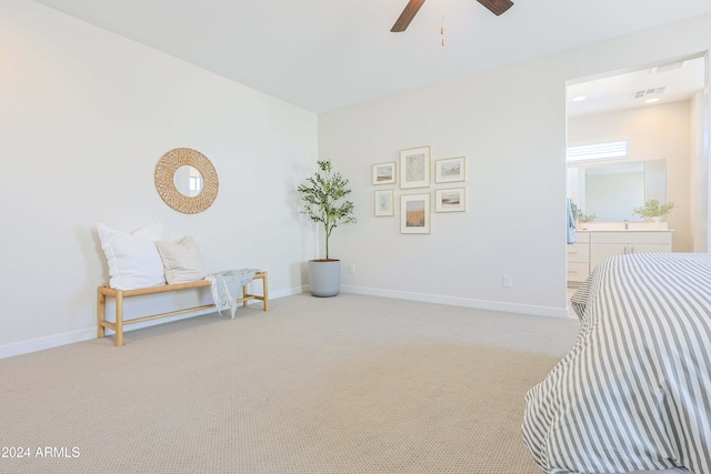 sitting room with light colored carpet and ceiling fan