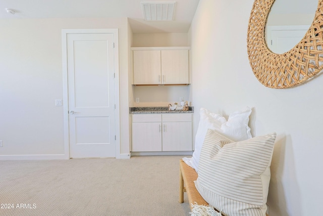 living area with light colored carpet