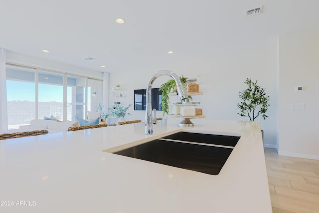 kitchen featuring sink and light wood-type flooring