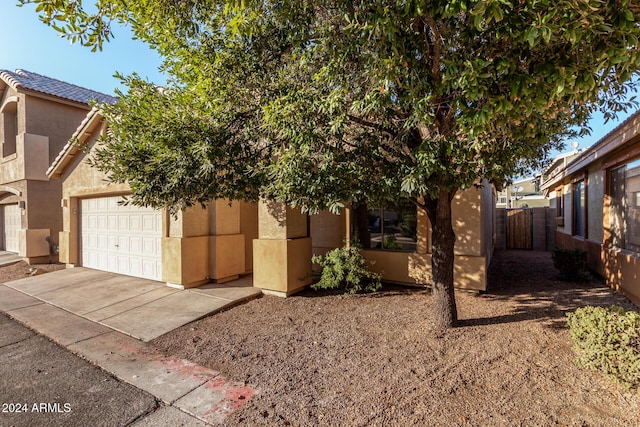 view of side of home with a garage