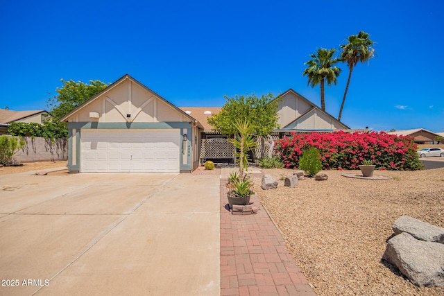 12529 N 83rd Ln, Peoria, AZ 85381 - view of front facade with driveway, a garage, and stucco siding