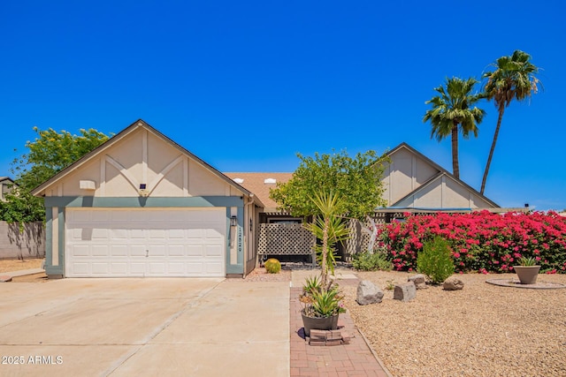 12529 N 83rd Ln, Peoria, AZ 85381 - view of front of house with driveway, an attached garage, and stucco siding