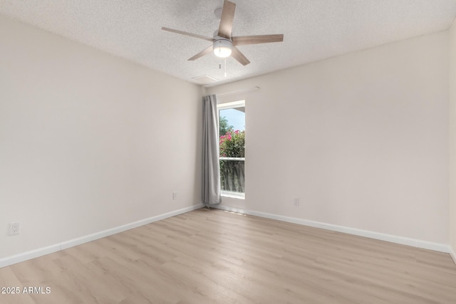 12529 N 83rd Ln, Peoria, AZ 85381 - unfurnished room featuring light wood-style floors, a textured ceiling, a ceiling fan, and baseboards
