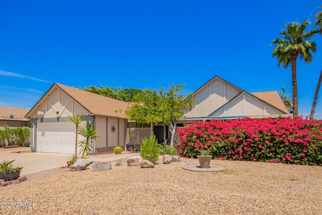 12529 N 83rd Ln, Peoria, AZ 85381 - view of front facade featuring a garage, driveway, and stucco siding