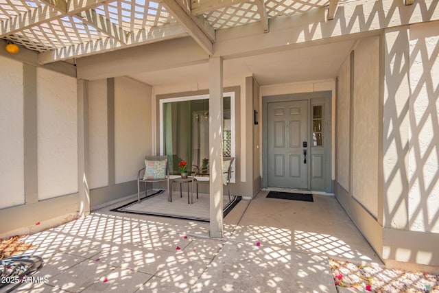 12529 N 83rd Ln, Peoria, AZ 85381 - doorway to property featuring stucco siding and a pergola