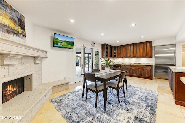 dining space featuring a premium fireplace