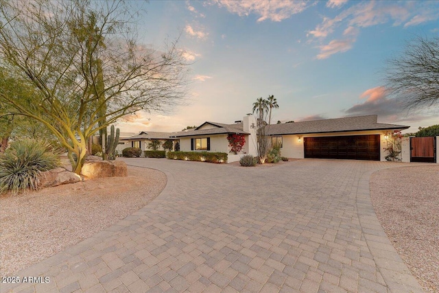 ranch-style house featuring a garage