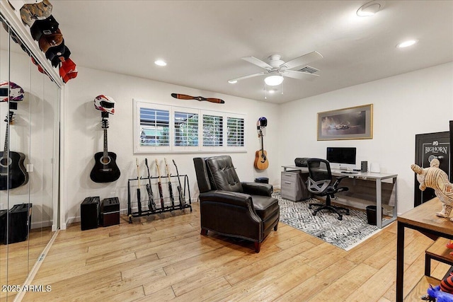 office featuring ceiling fan and light wood-type flooring