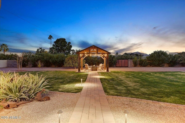 view of front of home with a gazebo, a patio, and a lawn